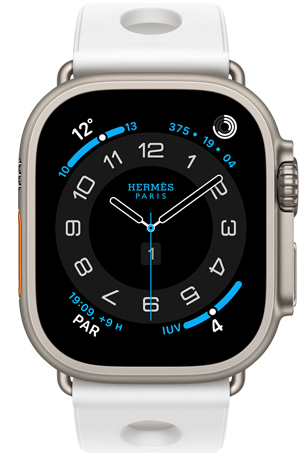 Apple Watch Hermes Ultra 3, boîtier en titane, naturel, cadran Hermes Circulaire, complications : météo, anneaux d’activité, heure de Paris, indice UV, bracelet Scub’H Diving, blanc