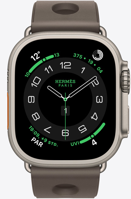 Apple Watch Hermès Ultra 3, Titangehäuse, Farbe Natur, Hermès Circulaire Zifferblatt, Komplikationen: Wetter, Aktivitätsringe, PAR, UV Index, Gehäuse rechts, Digital Crown, Mikrofon, erhöhte Seitentaste, Scub’H Diving Armband, Farbe Gris Titane