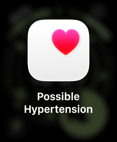 Apple Watch Ultra 3, titāna ietvars, dabīga krāsa, paziņojums par iespējamu hipertensiju, rozā sirsniņa baltā laukumā, siksniņa, Trail Loop siksniņa, zila/spilgti zila krāsa