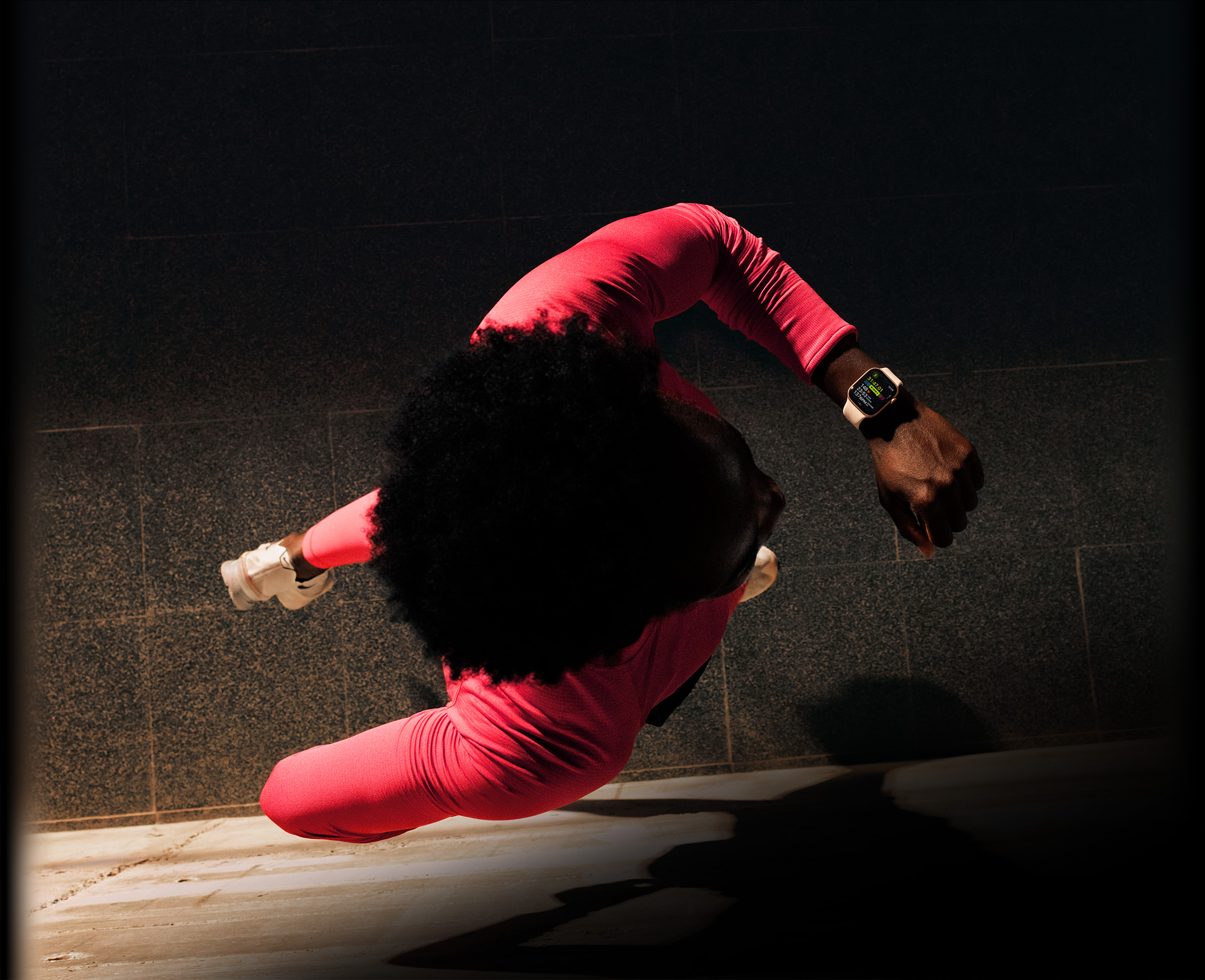 A person checks progress on Apple Watch Series 11 Workout app while running