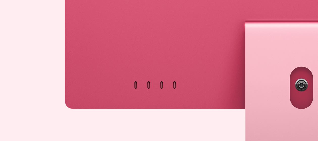 Vista posterior de un iMac rosado que muestra los cuatro puertos USB-C